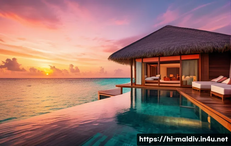 몰디브 최고급 리조트 - A luxurious private water villa in the Maldives at sunset, featuring a spacious wooden deck with a p...